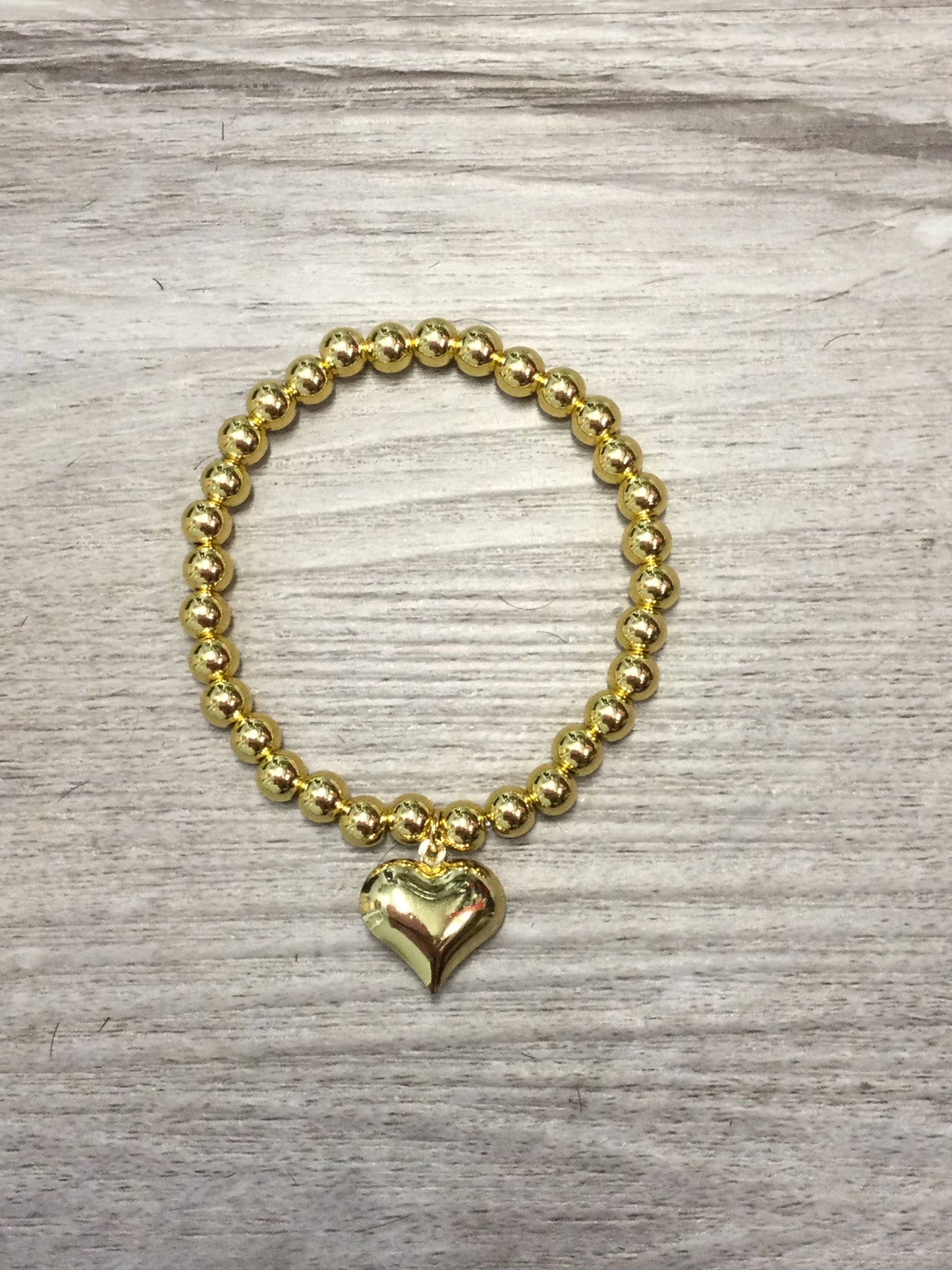 Pulsera de balines y corazón (Oro Laminado)
